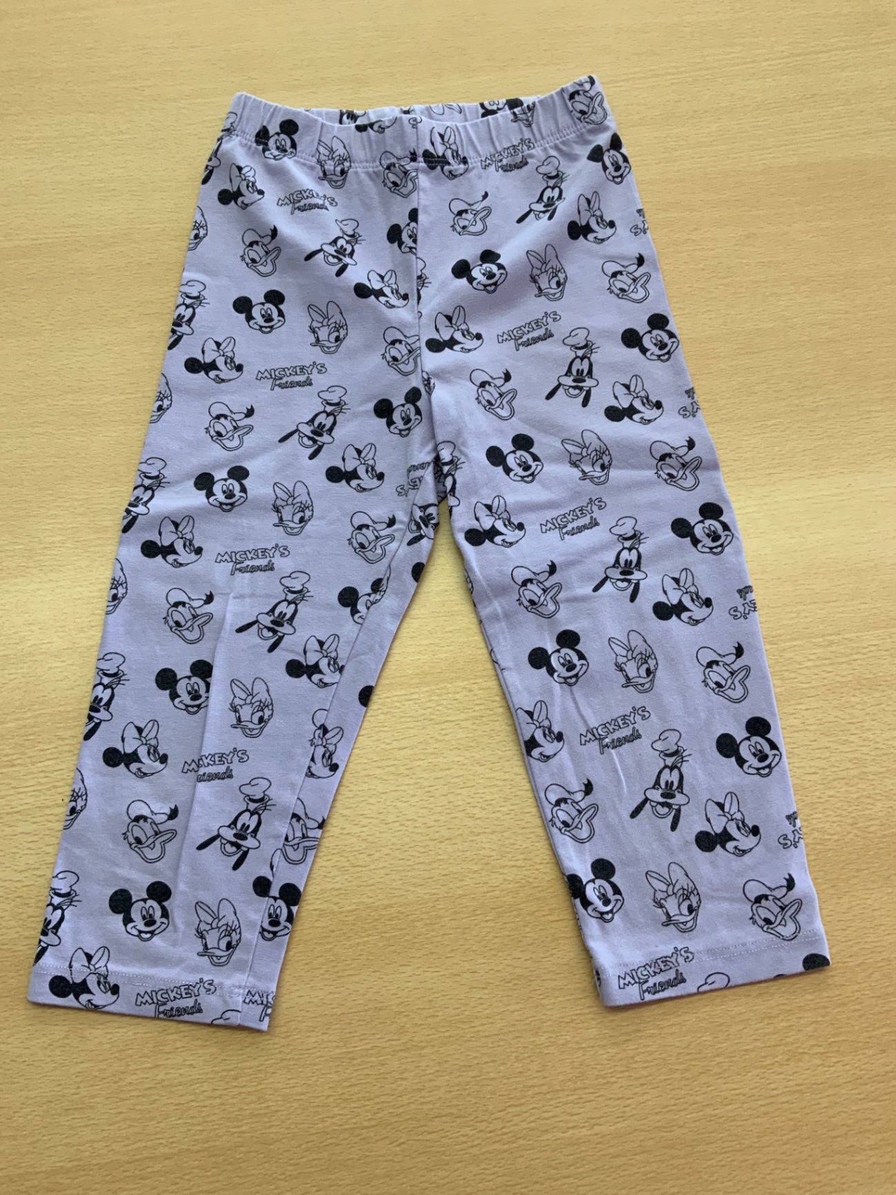 Leggins 116/122 Lila mit schwarzen Mickey Mouse und Donald Duck Mustern