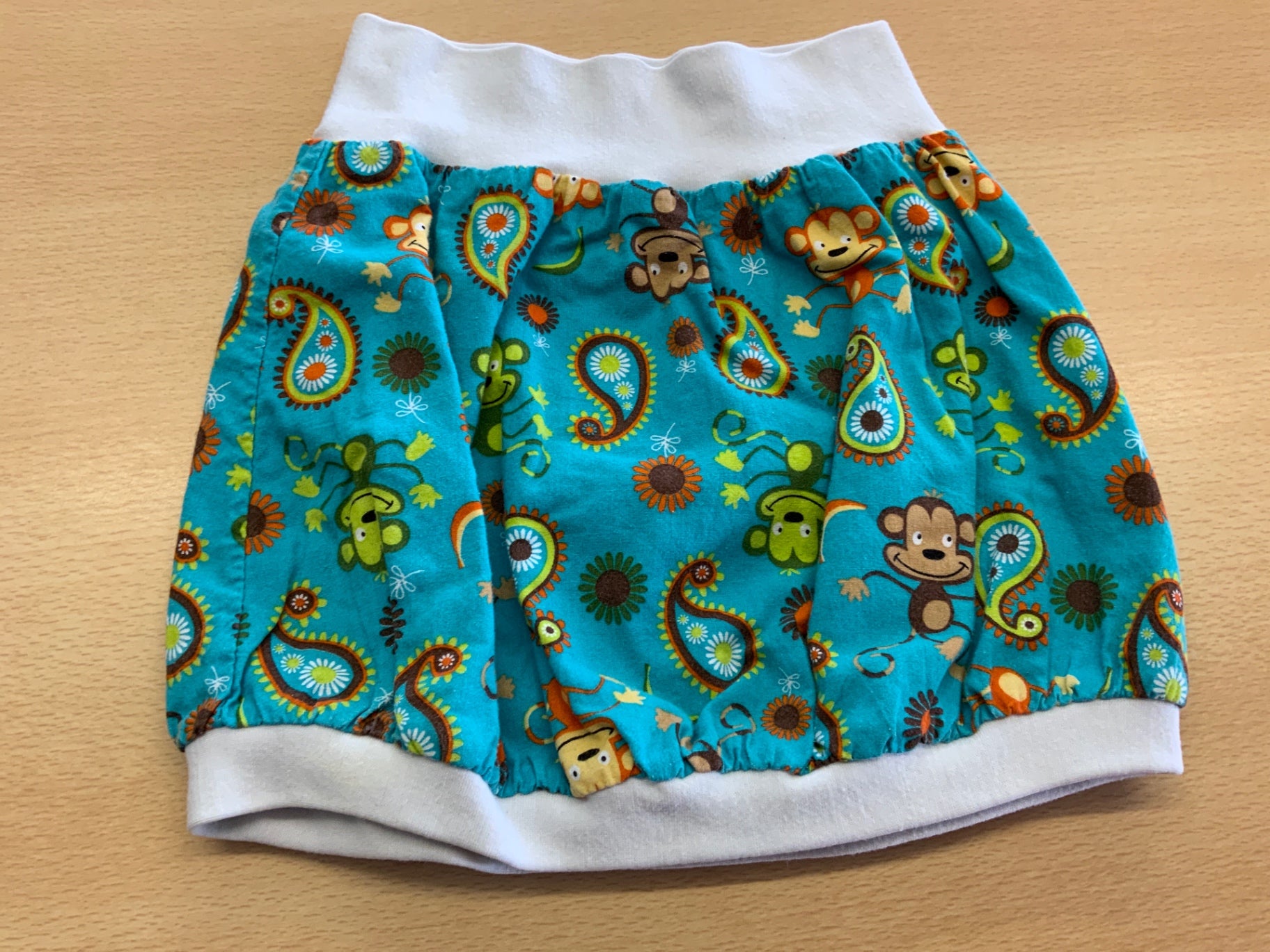 Jupe 98/104 Blau mit buntem Dschungel-Print