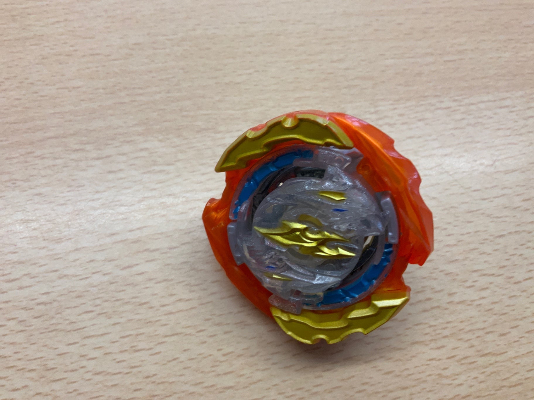 Beyblade Mehrfarben (Orange, Gold, Blau, Silber)