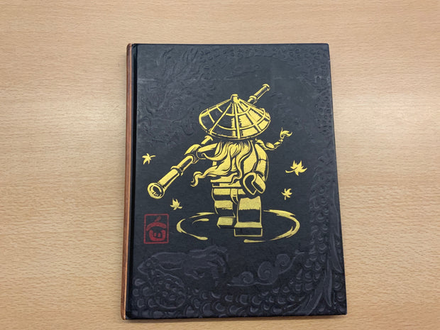 LEGO Buch Die Lehre des Spinjitzu Schwarz und Gold