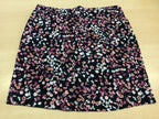 Jupe M Schwarz mit Blumenmuster in Weiß, Pink und Orange